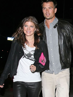Fergie is seen here with a western style pink clutch. Photo from Purse Blog.
